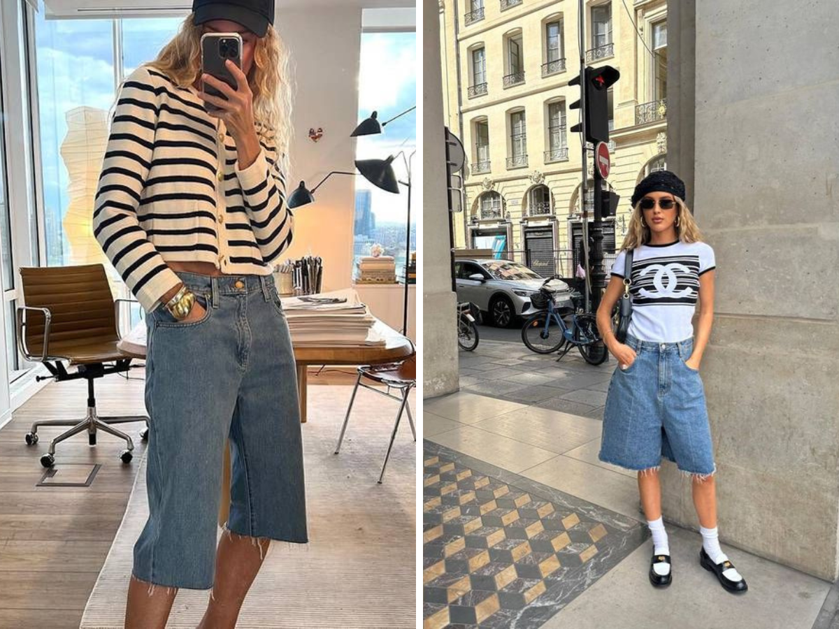 tendência Jorts. Foto mostra duas mulheres com uma bermuda longa, abaixo do joelho e tecido jeans. Uma delas tem uma camiseta de manga comprida branca e listras pretas e a outra camiseta branca com desenhos e chapéu preto. Uma usa o celular para tirar a foto, a outra posa para a foto na rua. 